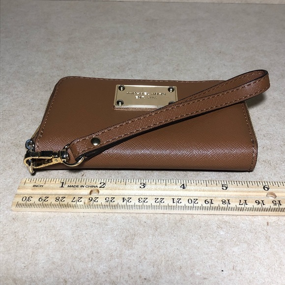 9. Michael Kors Cognac Zip Around Wristlet - Picture 12 of 14